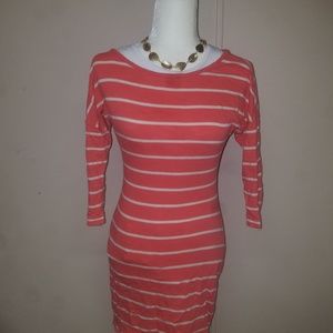 Tunic or mini dress. Above the knee.